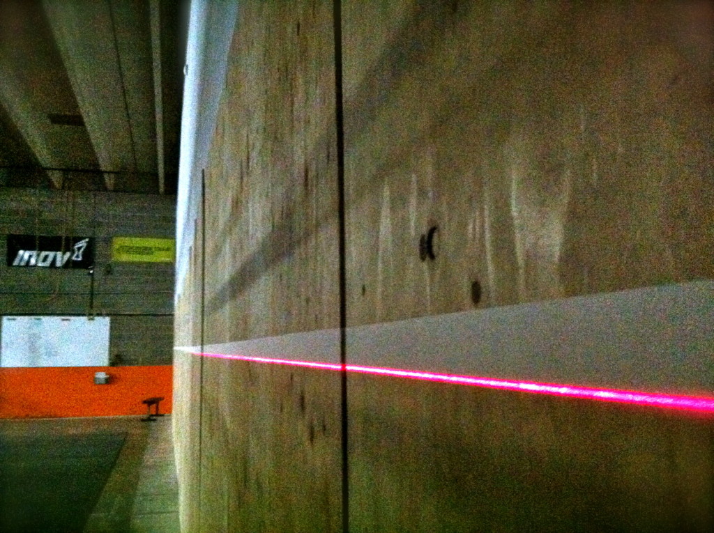 We used a laser level to create a crisp line on a plywood wall to lacquer it.