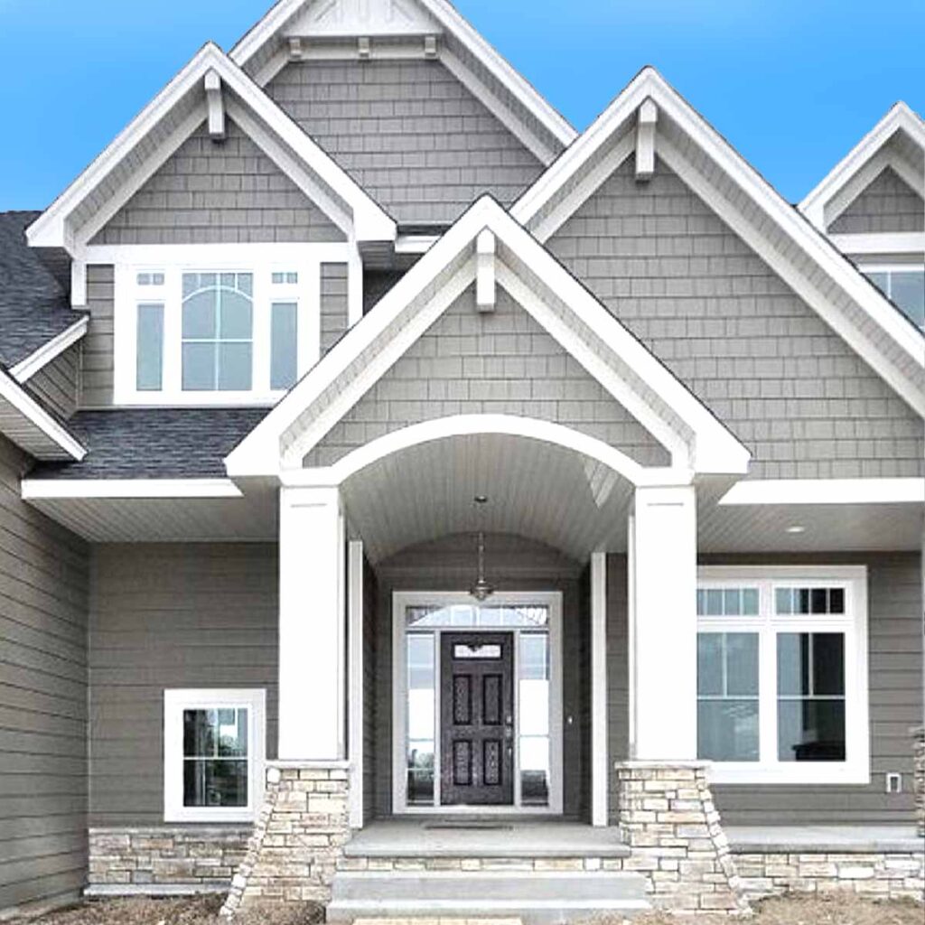Exterior of home painted grey with white trim
