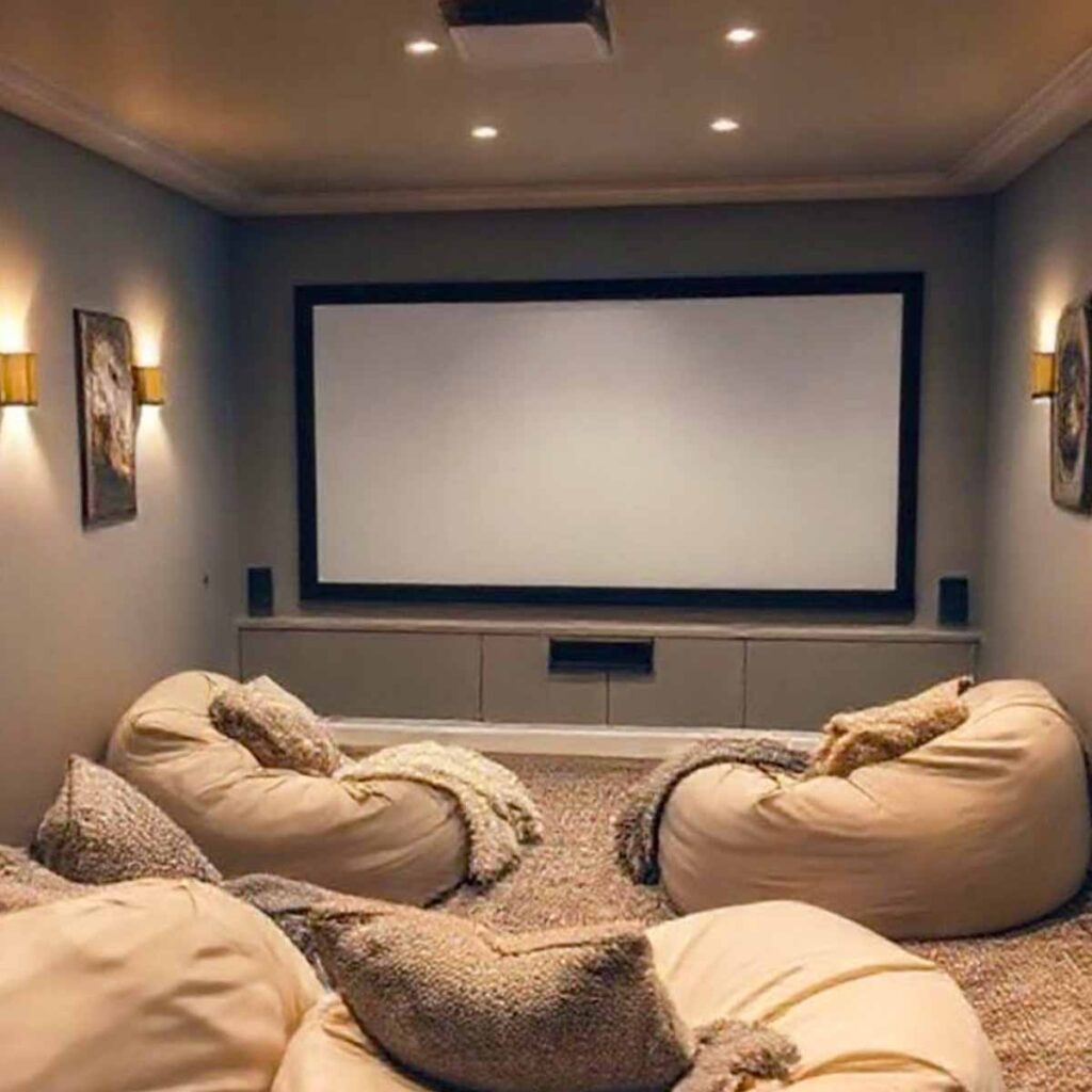In home theater with soft grey paint on walls with white trim